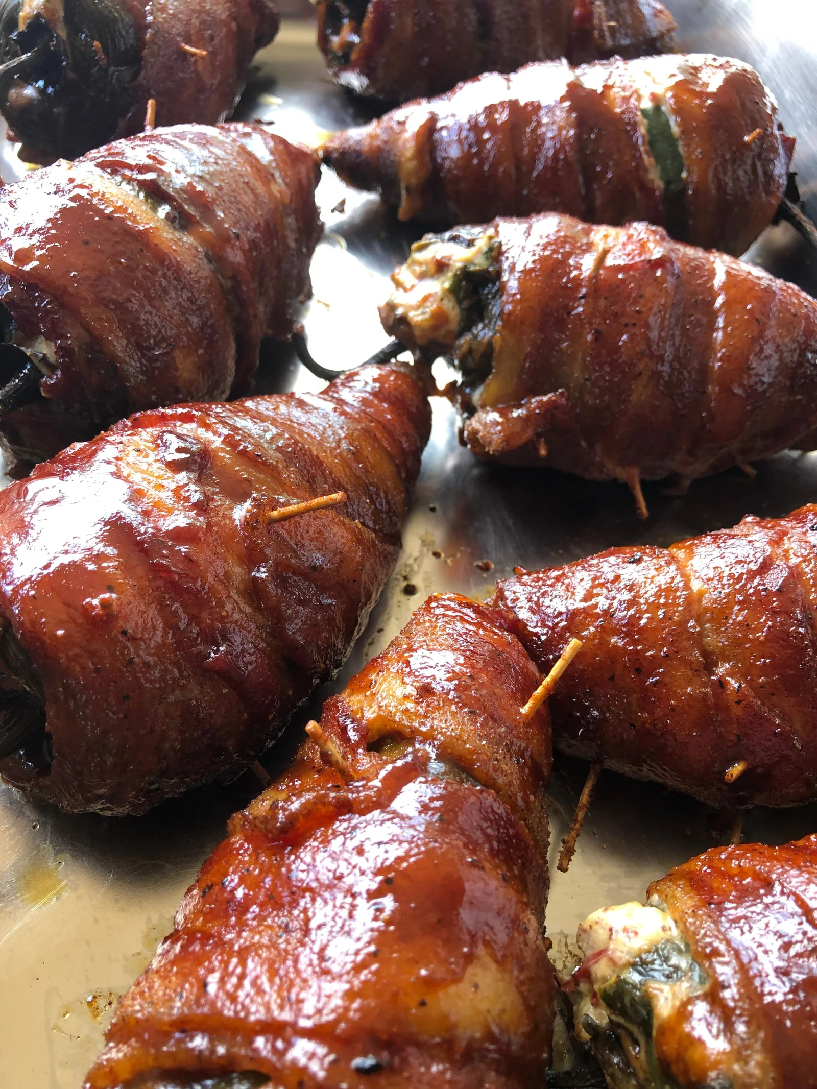 Bacon-wrapped stuffed peppers with a browned finish