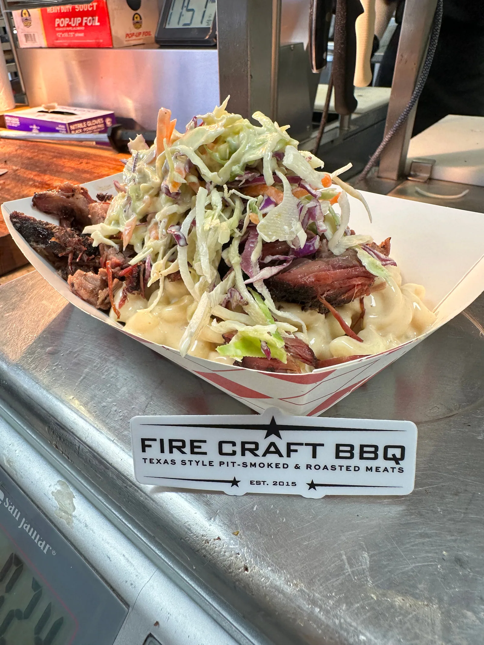 Barbecue piled over macaroni with slaw