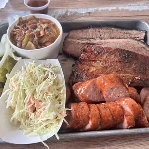 Fire Craft three meat plate with brisket, sausage and sides