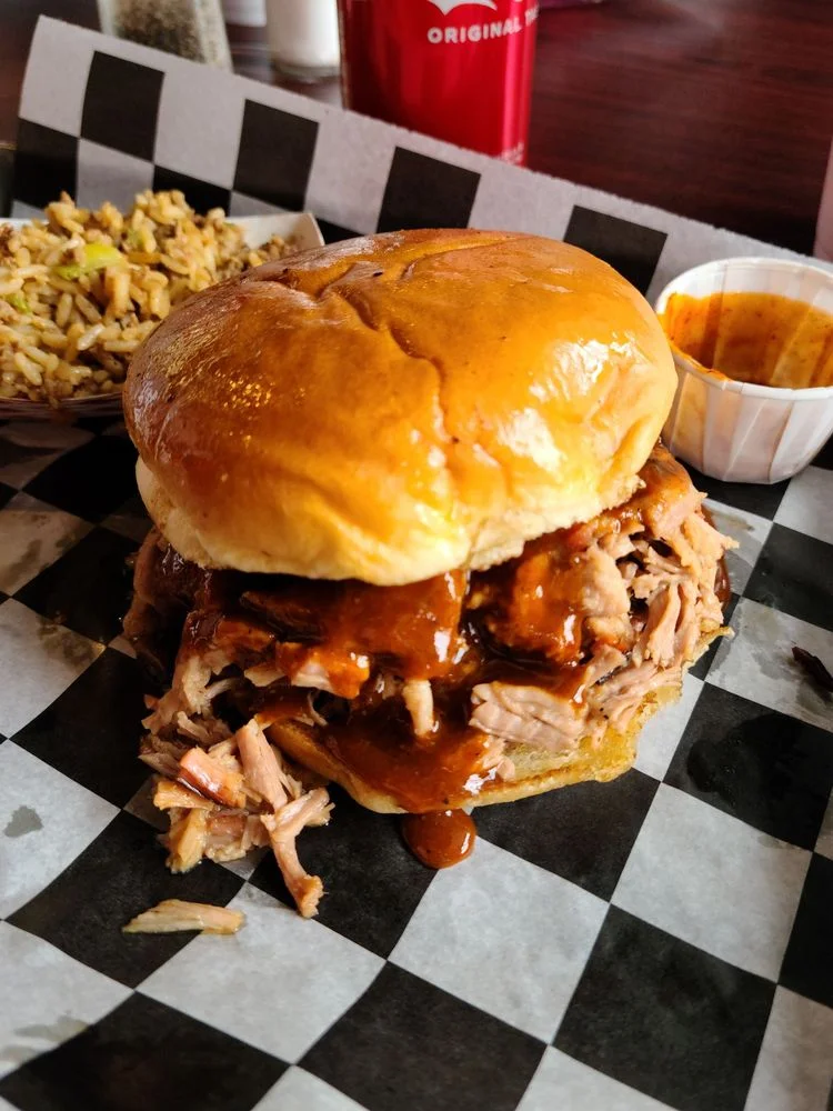 A Fire Craft brisket sandwich on a toasted bun